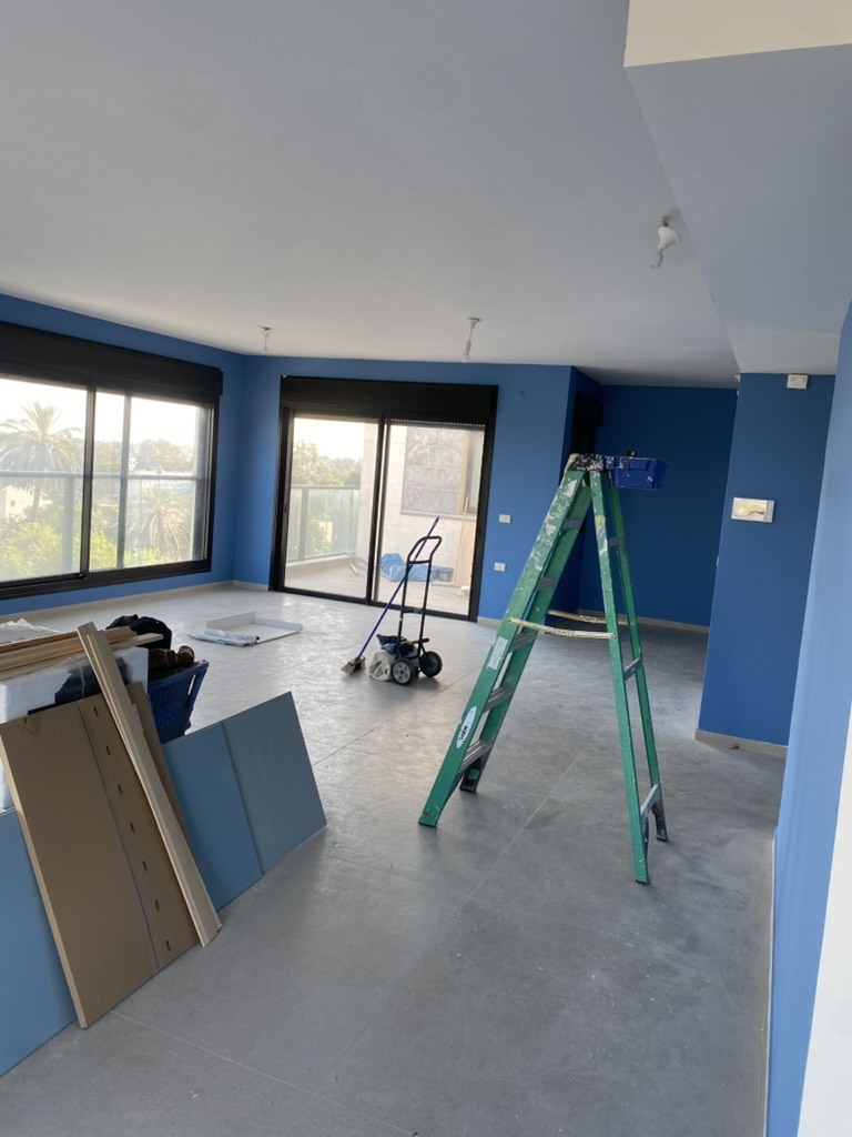 Blue walls in a living room during a painting project